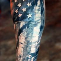 Black and White Ink Famous American Flag Tattoo On Men Sleeve